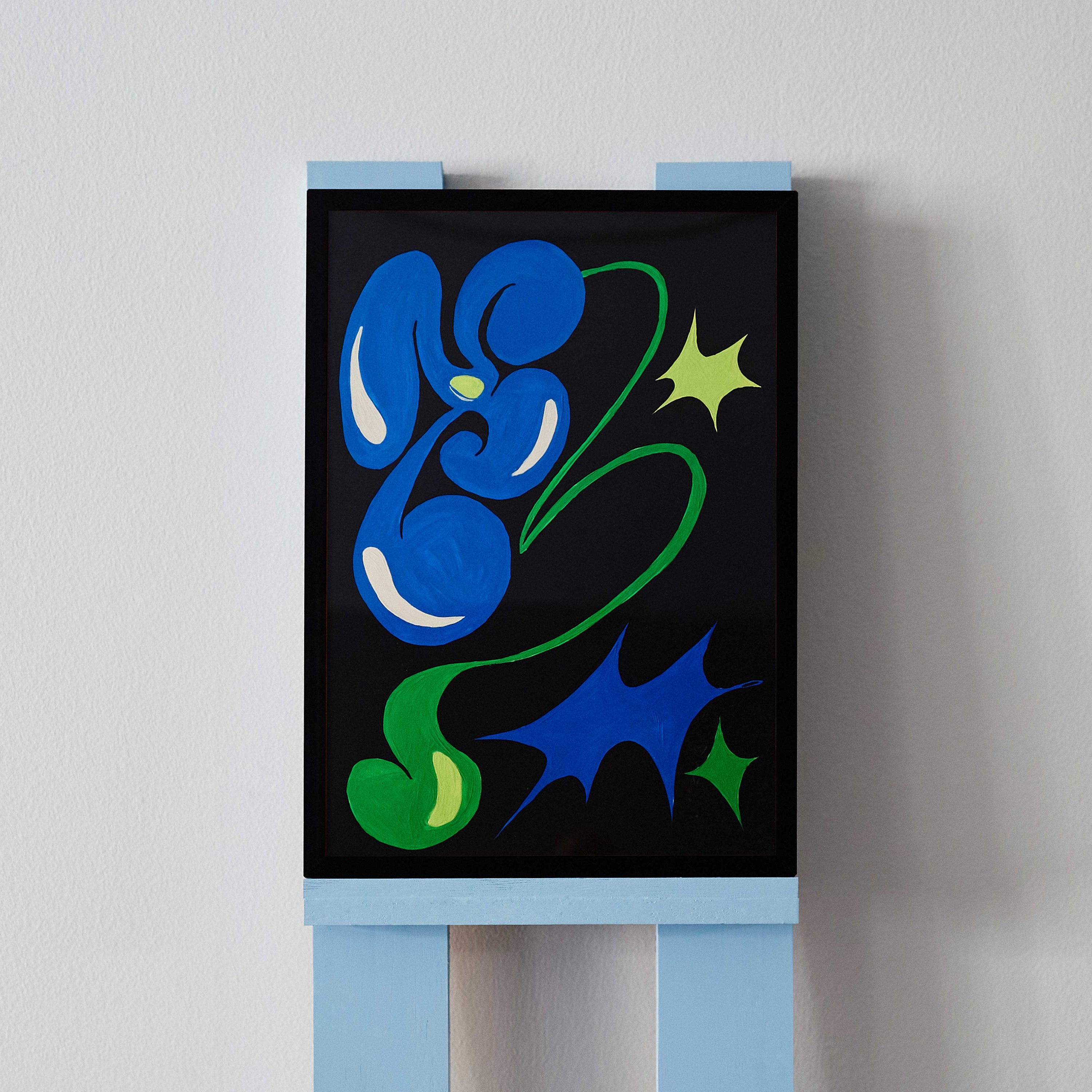 'Flower Arrangement 4' is an original acrylic painting by Angela Tam. It features a dynamic depiction of a blue four petal flower, stemming from a whimsically shaped green base. The black background contrasts with the bold, vibrant colours of the surrounding stars. Displayed on a black frame.