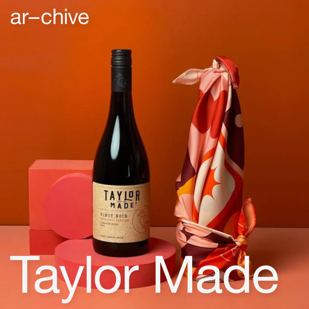 Blog cover for ar-chive studio's collaboration with Taylor Wines. Square tile featuring a wine bottle and a red, pink scarf.