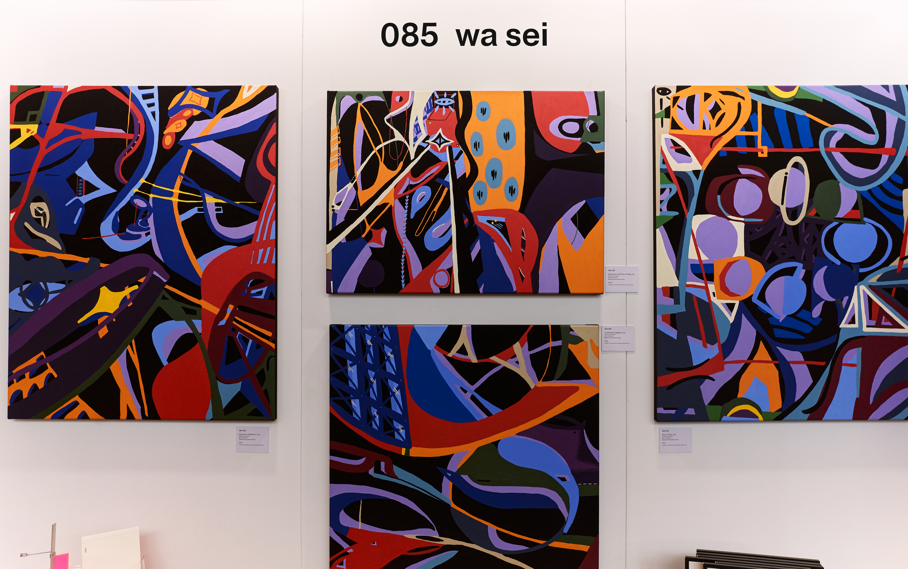 wa sei stall at The Other Art Fair (Sydney) 2024. Colourful, bold, abstract paintings hanging on a white wall.