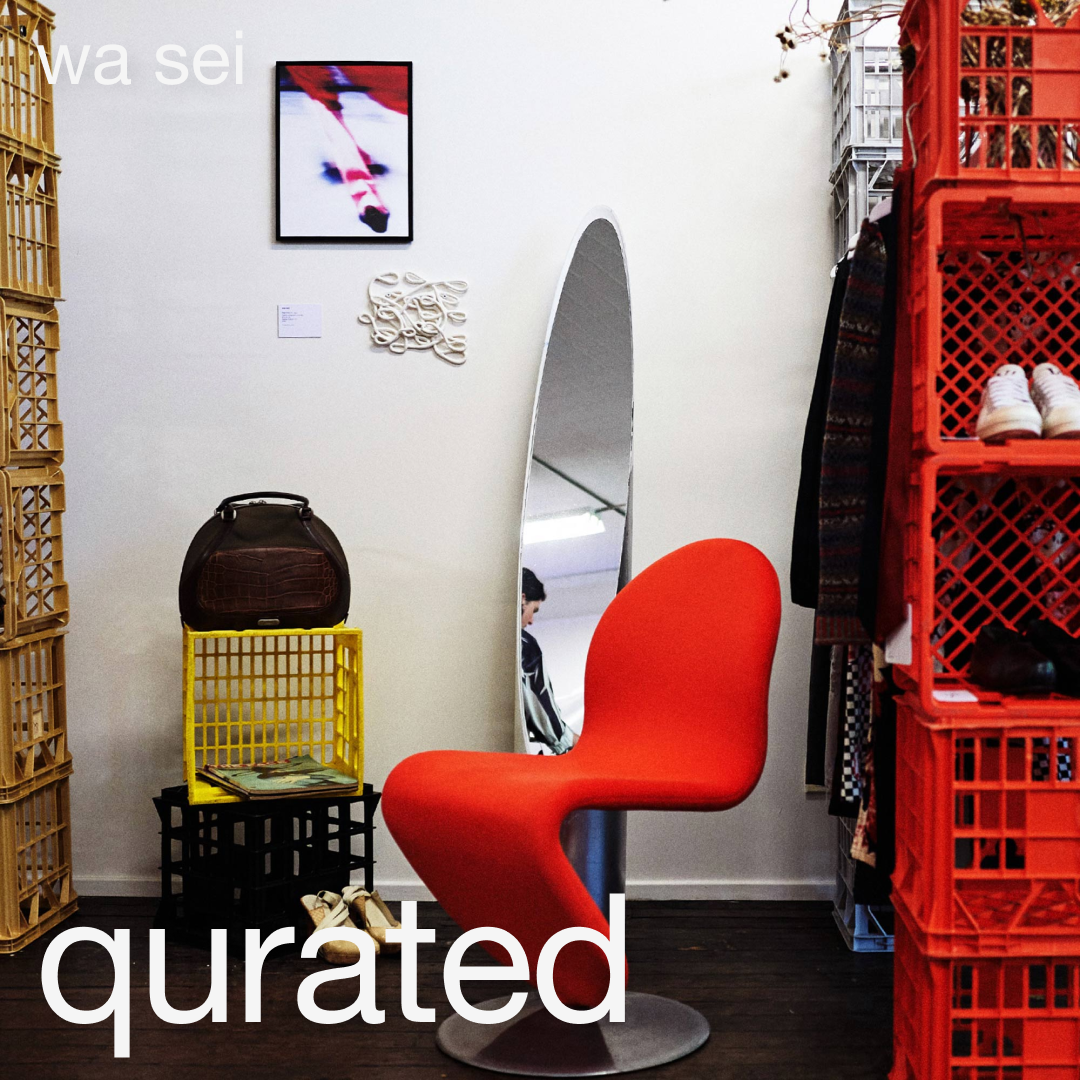 wa sei's blog cover: Original artworks at qurated art market. Red Verner Panton chair, colorful milk crates, oval mirror, and framed artwork by wa sei