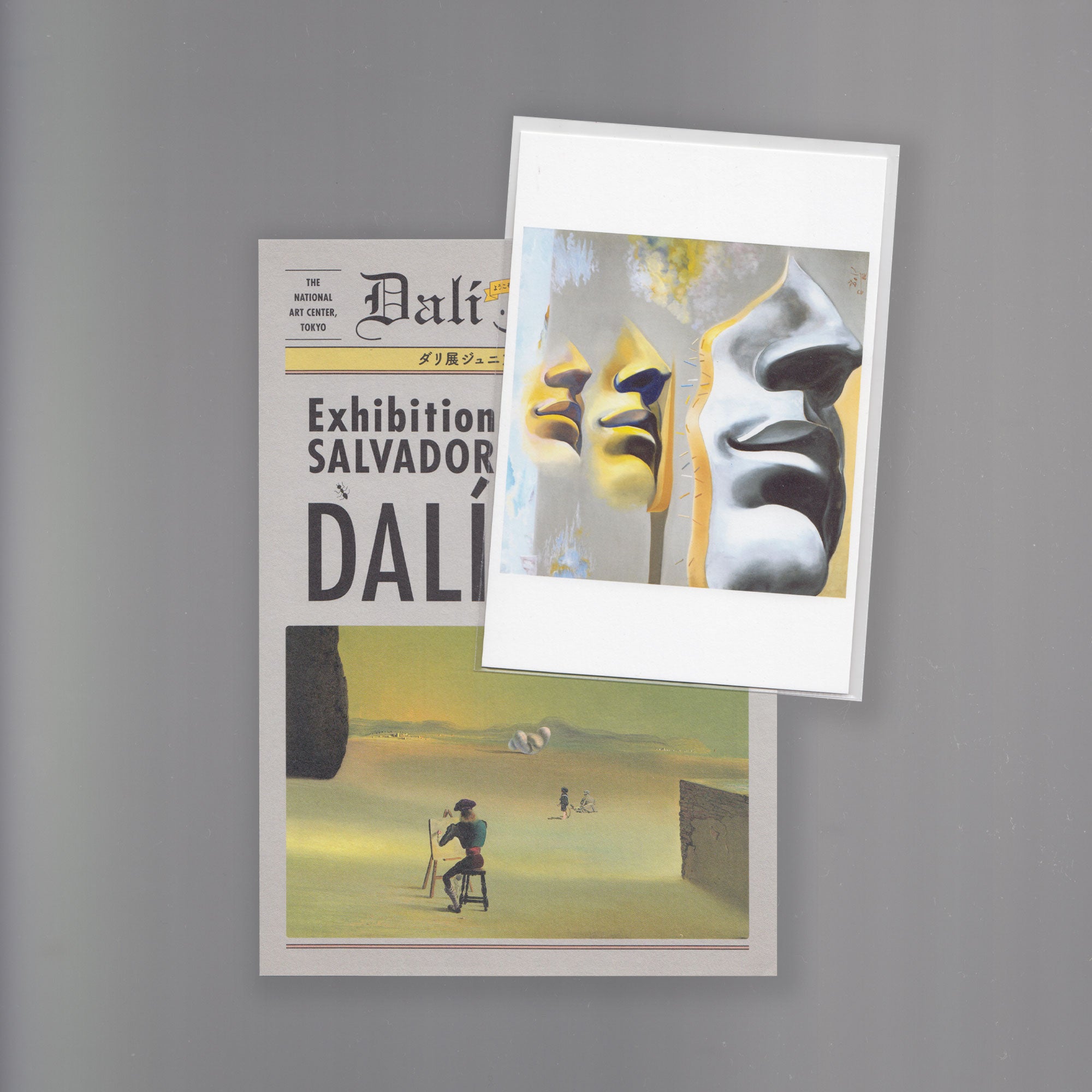 Two scanned images of a postcard with a newspaper template with "Dali" inscribed. The second postcard displays a Dali artwork of three faces in yellow and grey.