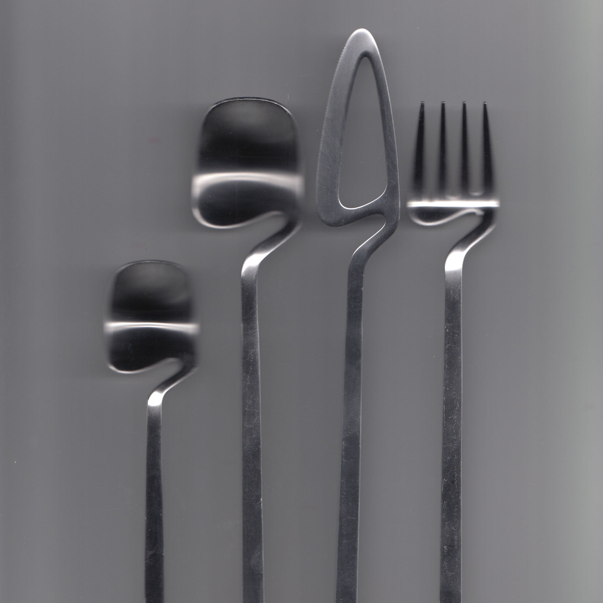 Scanned photo of stainless steel Japanese designed kitchen utensils by Japanese design studio, 'Nendo'.
