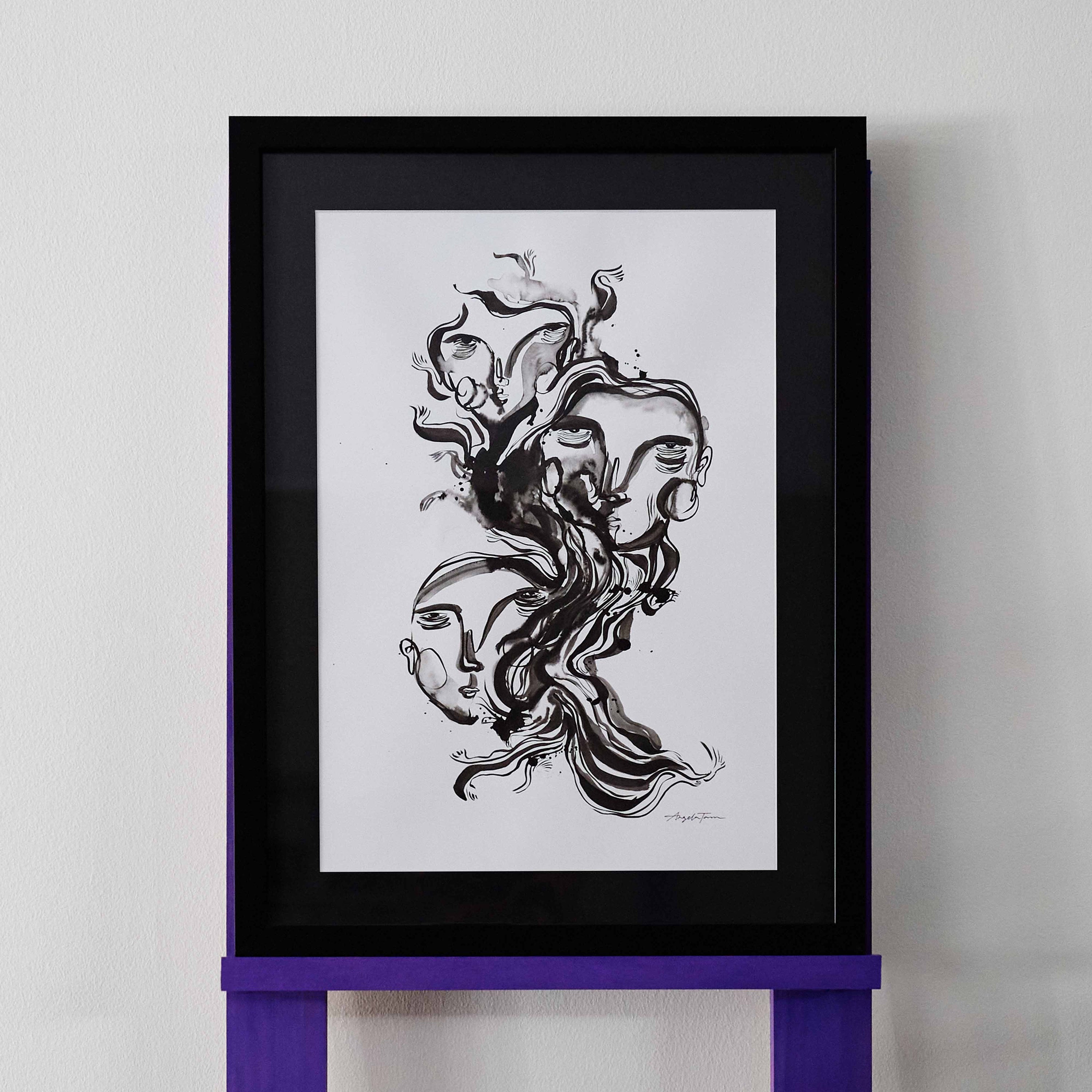 'Guides' is an original artwork by Angela Tam housing three abstracted faces with a large wave of ink lines through the middle. The faces join to the curved lines as if emerging from them. The artwork is on a white background and framed with a black mount and border.
