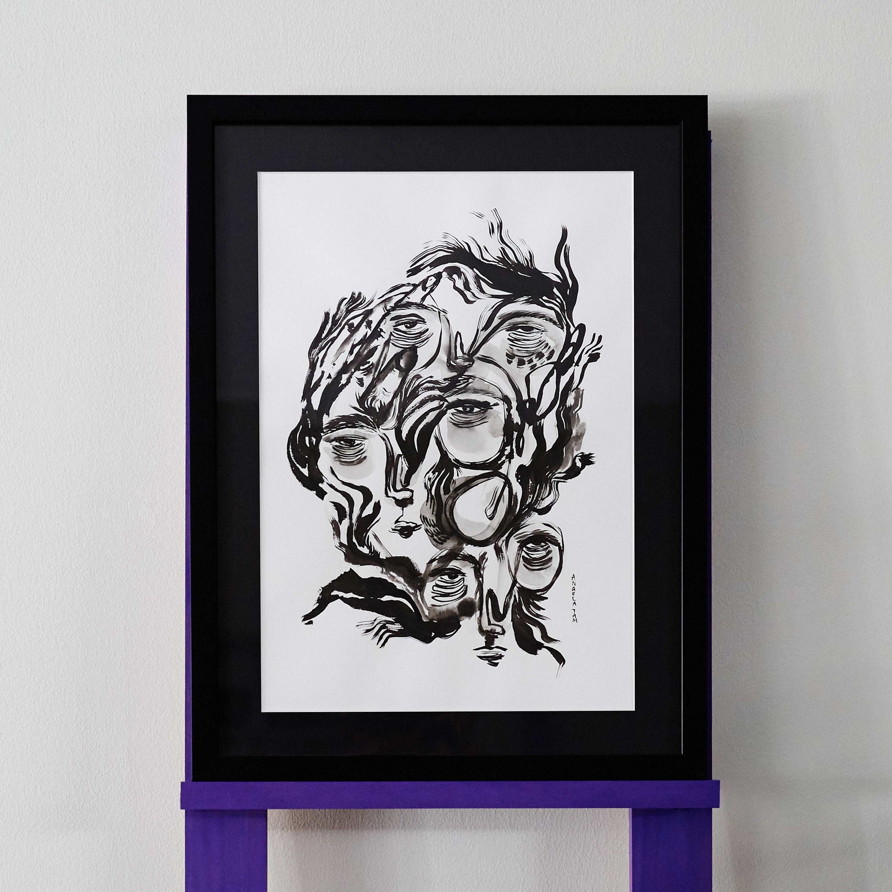 Angela Tam's original ink painting, 'What If It Never Ends' uses thicker, drier brush strokes to depict three abstracted faces amongst a contoured mental landscape. The bold lines create a sense of urgency and constrasts heavily to the white background and black frame.