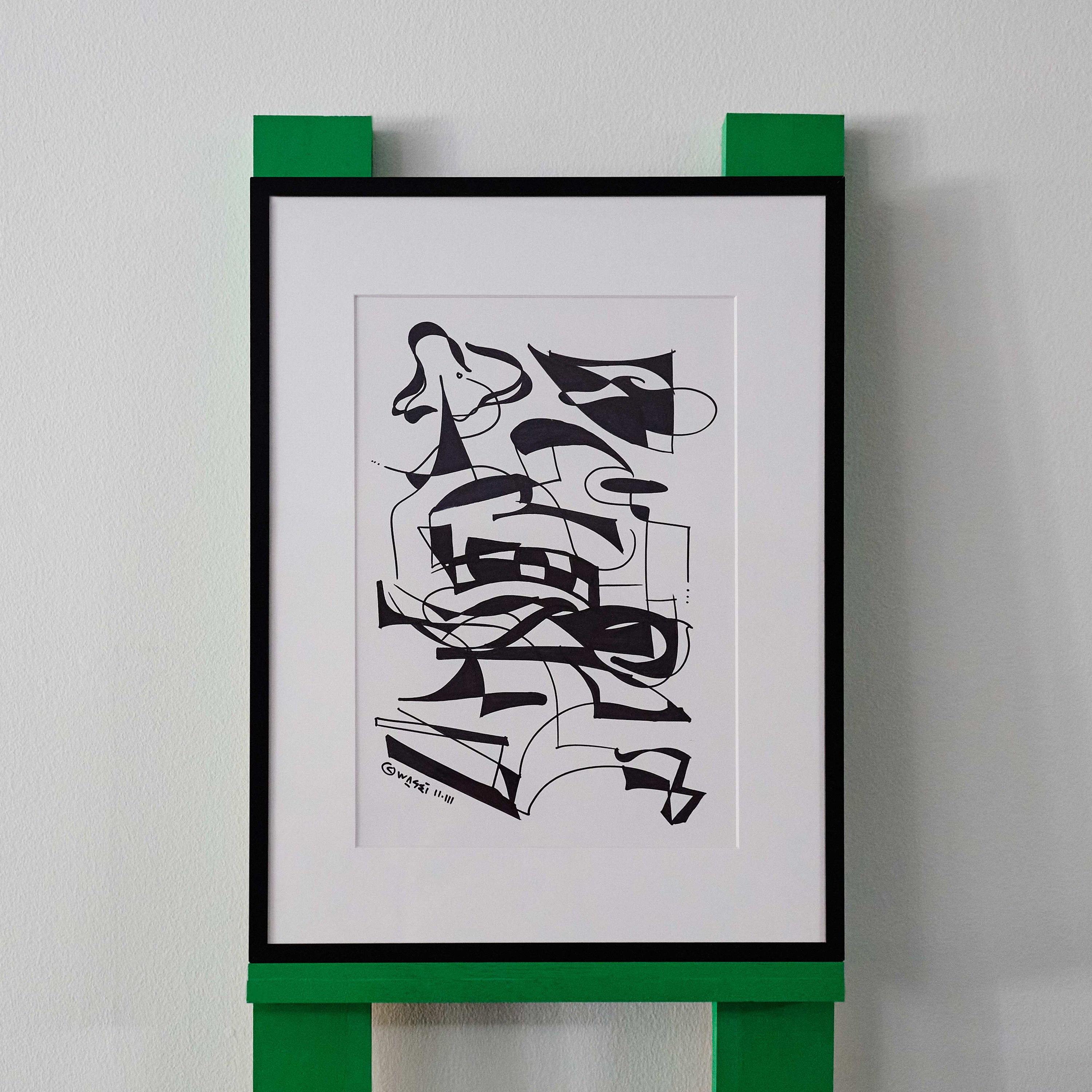 A black and white line drawing by wa sei. The artwork depicts abstracted patterns and shapes, displayed in a sleek black frame.