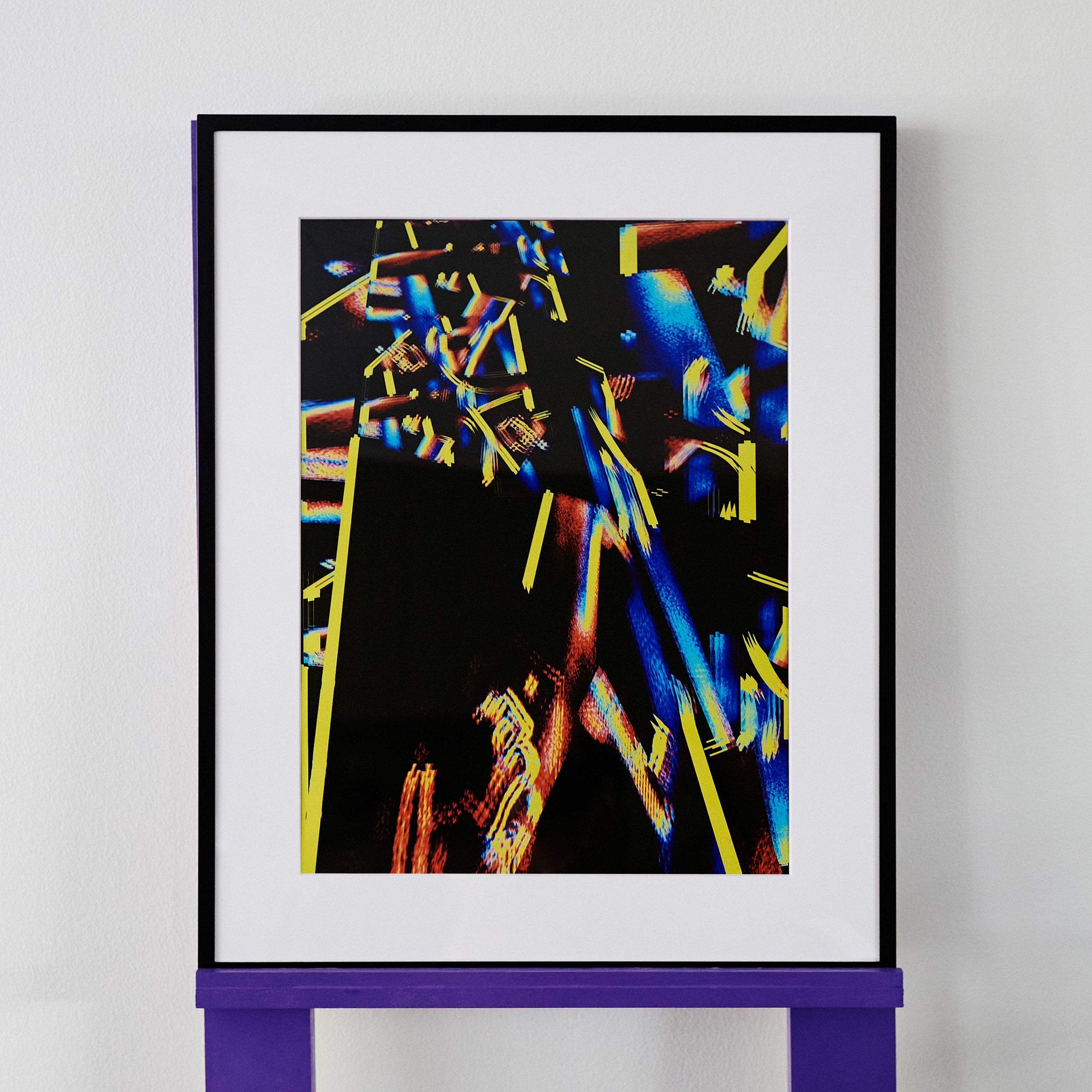 wa sei's abstract artwork 'zzaJ' is composed of vibrant hues of electric blue, yellow and red on a black background. The original artwork is displayed in a black frame.